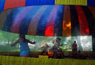 Kids enjoy the bounce house at the 2014 Gaspee Days Arts and Crafts Festival Sunday, May 25.