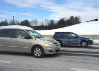 A car with the snow and ice from the last snowstorm still riding with the driver at 55 mph. There is an $85 fine in RI for driving your car in this condition.