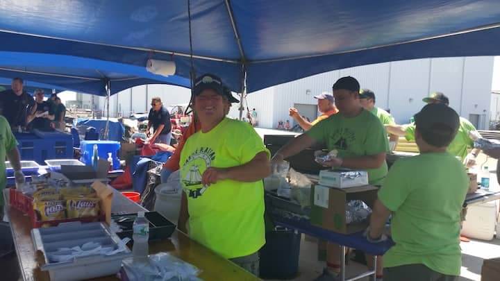 Carol Blais helps cook up some chicken pitas and beef gyros for Troop 1 Gaspee Plateau of Warwick.