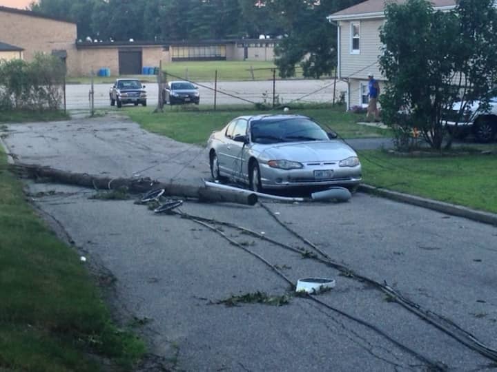 Wires in the street with a downed pole on Everleth Avenue after the Aug. 4 storm.