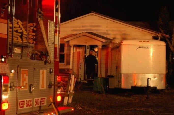 [CREDIT: Rob Borkowski} Paul Germain speaks with firefighters inside his house at 155 Greeley Ave. Dec. 28 after the WFD put out a fire there. 