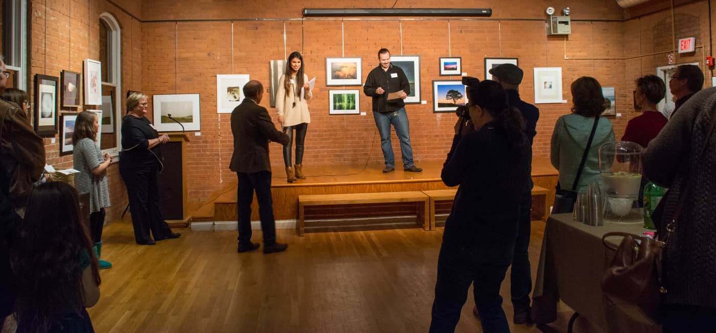 From left, WMOA Executive Director Taylor and show juror Brett Henrickson introduce the Nature's Gift exhibit Wednesday night at WMOA.
