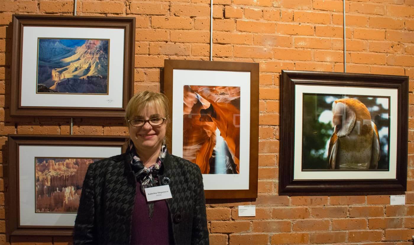 Kate Stepanova with her photo, "Antelope Canyon" at WMOA Wednesday night.