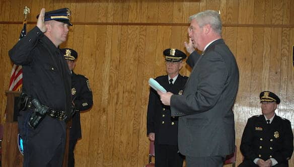 [CREDIT: Rob Borkowski} Mayor Scott Avedisian, right, swears in Sergeant Frank McGee.