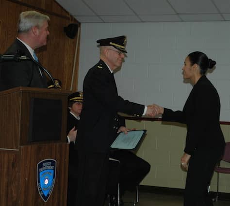 [CREDIT: Rob Borkowski} From left, Mayor Scott Avedisian and Col. Stephen McCartney present Gilda T. Fortier with her certificate honoring her new rank as detective.