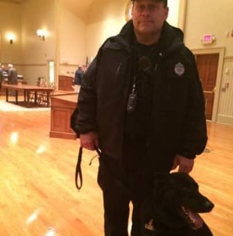Ptlm. Paul Wells and his partner, K9 Fox, at City Hall prior to the April 7, 2015 Warwick City Council meeting. The meeting was a continuation of that Monday’s meeting, which a bomb threat ended prematurely.