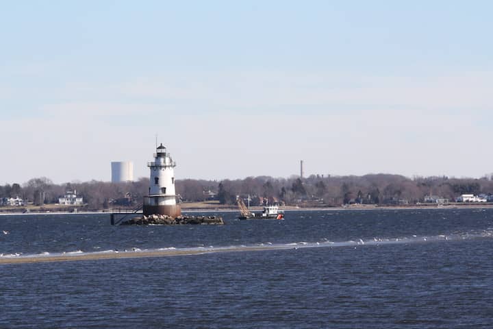 CREDIT: Beth Hurd] A boat off Conimicut Point during a search for missing Kayaker Michael Perry.
