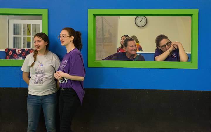 [CREDIT: Rob Borkowski] The festivities were very entertaining, as Carleen DeSisto, window, left, and Lisa Coons watch from a window during the 2018 Bark for Life. 