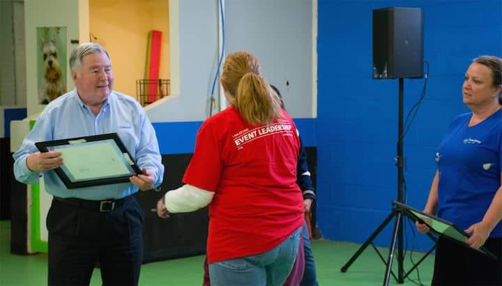 [CREDIT: Rob Borkowski] Tony DeJesus (Big Blue Bug Company) accepts an award during the end of the 2018 Bark for Life.