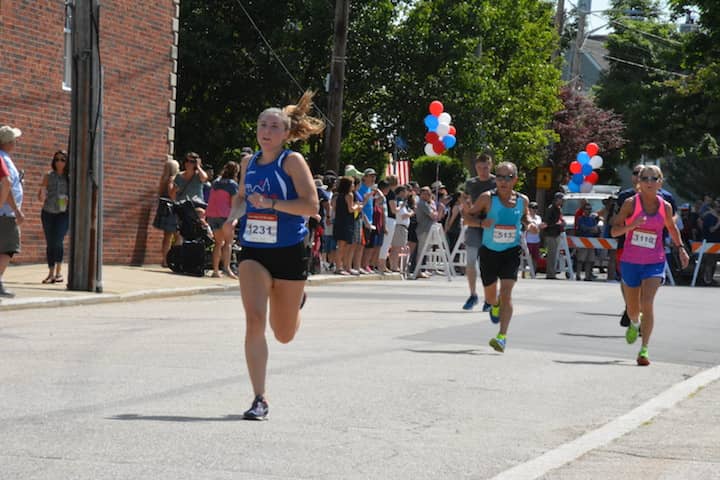 [CREDIT:Rob Borkowski] From left, Dankia Wayss, 20, of Warwick, Joe Demenezes, 61, of Warwick and Marge Bellisle, 62, of Warren near the finish line at the Gaspee Days 5K Saturday, June 10, 2018. 