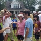 [CREDIT: Rob Borkowski] From left, Astronaut Woody Spring speaks with Lynn Antonelli and her nephew, Christian Tanguay, 17, after the Conimicut Apollo 11 anniversary parade.