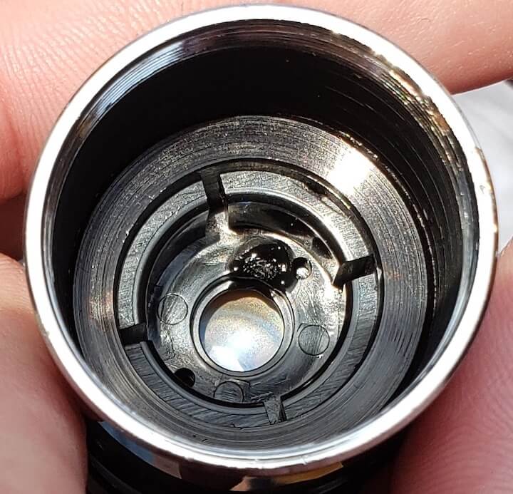 [CREDIT: Mary Carlos] Jason Major shows damage done to his lens by unfiltered sunlight through his telescope in Pawtuxet Village Nov. 11, 2019.