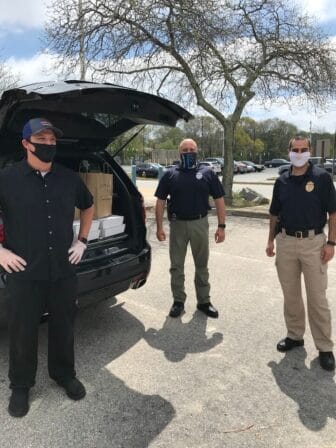 [CREDIT: Iron Works] Iron Works restaurant delivered more than 100 meals to Warwick fire, police and hospital employees May 15. Above, the WPD receives part of the delivery.