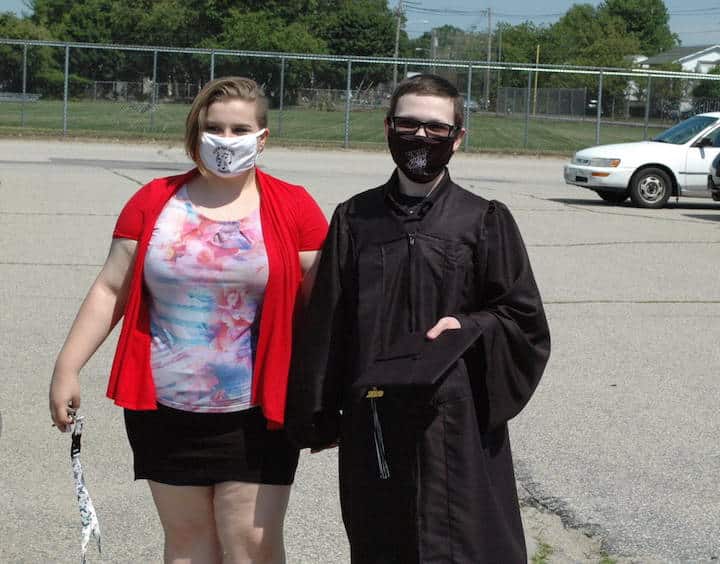 [CREDIT: Rob Borkowski] Pilgrim High 2020 grad Chris Castello, with Lexi Egan on his way to get his diploma during the 2020 Pilgrim High graduation.