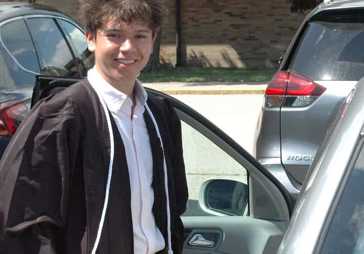 [CREDIT: Rob Borkowski] Pilgrim High 2020 grad Joshua Delaroca on his way to get his diploma during the 2020 Pilgrim High graduation.