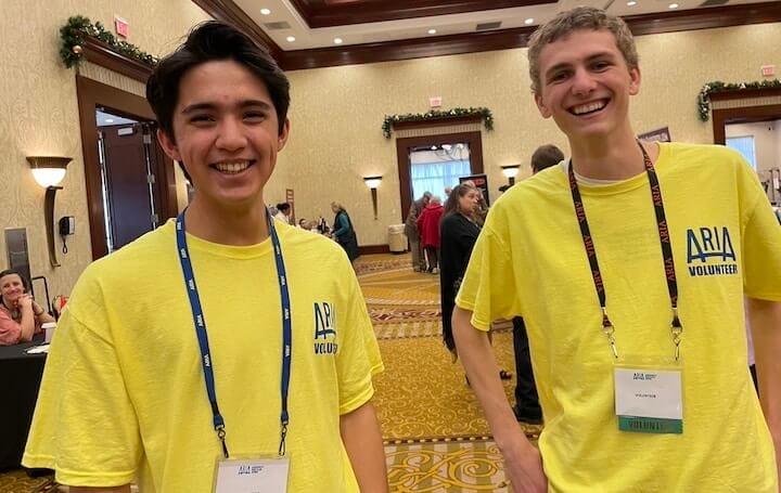 [CREDIT: Rob Borkowski] ARIA volunteers Julius Piercanuzi and Luke Patterson were canvassing the event, asking people about their experiences at the RI Author Expo at Crowne Plaza Warwick Saturday.
