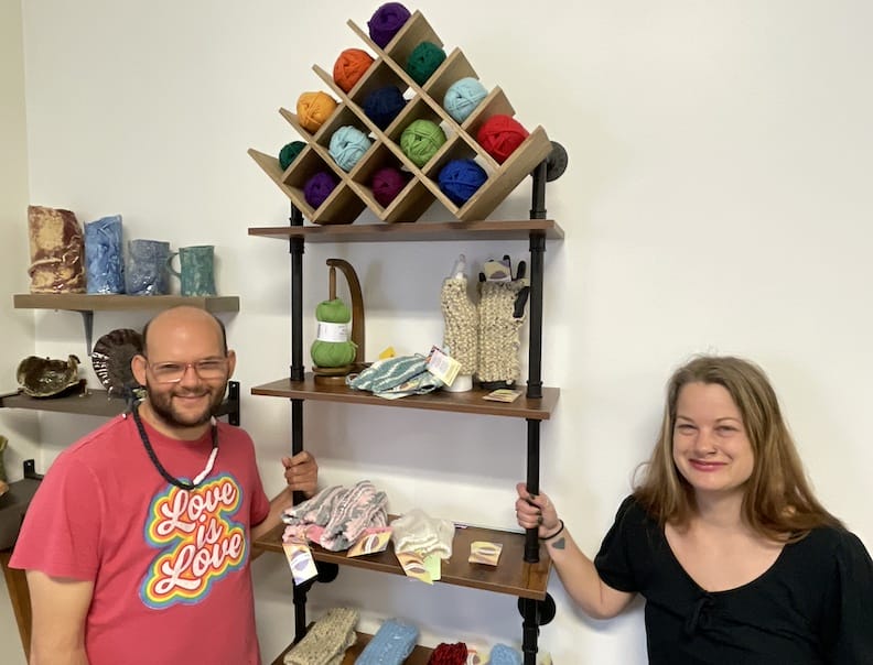 [CREDIT: Rob Borkowski] From left, Knitting artist Robert Brosnahan and Casey Weibust, Gallery manager at Out of the Box Gallery, with some of Brosnahan's wares for sale at the gallery.