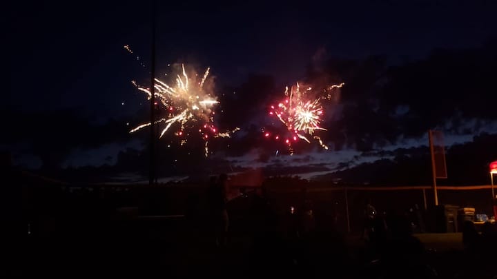 [CREDIT: Mary Carlos] Fireworks lit up the sky for families at CHS during the Summer Festival, Coventry's early entry into Fourth of July celebrations.