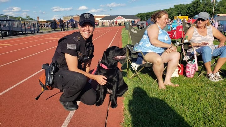 [CREDIT: Mary Carlos] Coventry Police Officer Jadine Ferri, Badge 45, and her K-9 partner, Jovie. She's Jovie's handler. The two were meeting and greeting families during the Summer Festival.