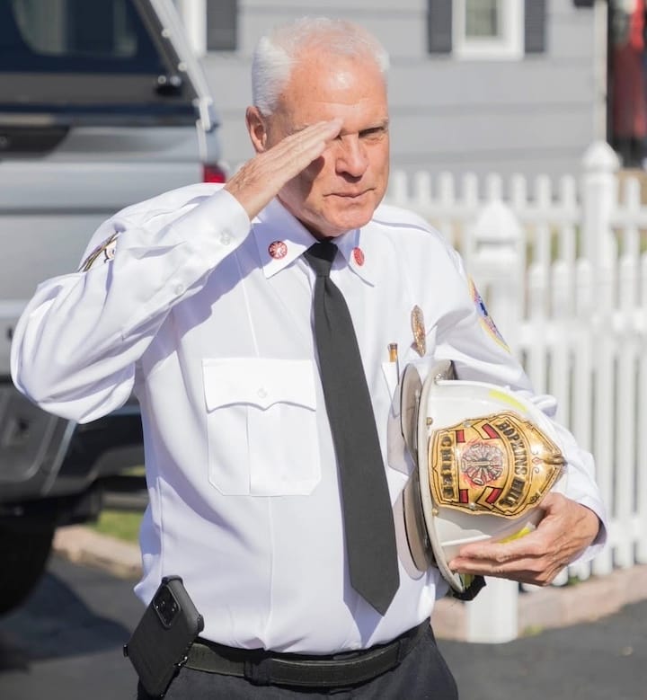 [CREDIT: Denise Brown] Hopkins Hill Fire Chief Frank Brown delivers a farewell salute during his last day before retiring as Hopkins Hill Fire Chief.