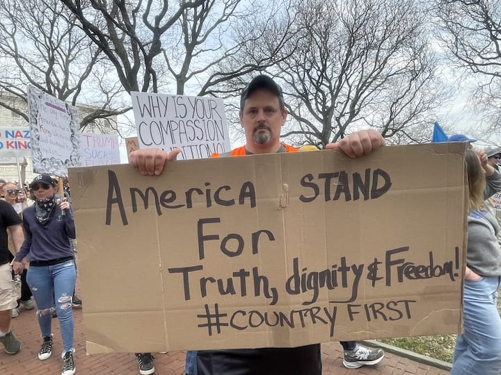 [CREDIT: Rob Borkowski] Adam Stolman, among thousands of people gathered at the State House April 19 Hands Off protest against the Trump Administration
