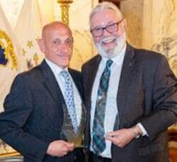 [CREDIT: MHARI] From left, Senate Finance Chairman Louis P. DiPalma and House Environment and Natural Resources Chairman David A. Bennett following the presentation of the Mental Health Association of Rhode Island’s Legislator of the Year awards.