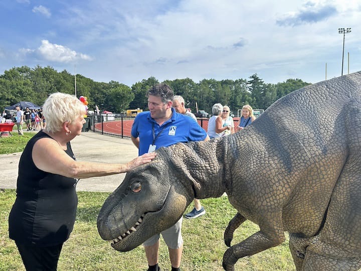 [CREDIT: Natalie Ferland] Roger Williams staff member and his friend Rexy delight Coventry residents at this year's Summer Festival.