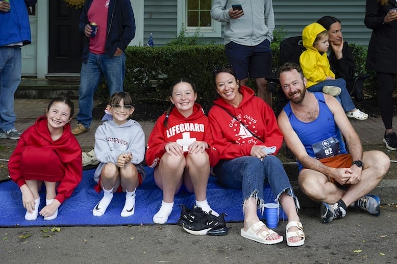 [CREDIT: Laura Paton] The Connors family of Cranston watches as the 2025 Gaspee Days Parade passes by.