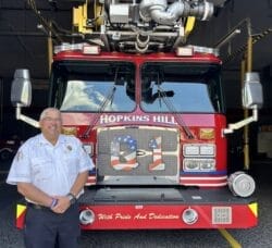 [CREDIT: Natalie Ferland} Hopkins Hill Fire Chief John Potvin, newly hired to take the reins from retired Chief Frank Brown, in front of the Hopkins Hill station.