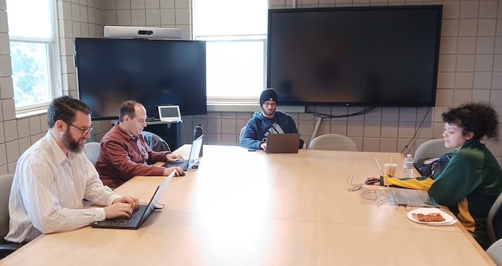 [CREDIT: CCRI] The CCRI cybersecurity team during a recent practice meeting. From left are Caleb Car, Zachary Hartmann, Corey Davis and Maria Monteiro.