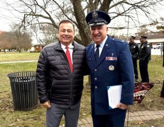 [CREDIT: Kim Wineman] Warwick honored local veterans Tuesday, Nov. 11, 2025 during a Veterans Day observance. Above, RI House Speaker Joseph Shekarchi and Rev. Marciano at Warwick Veterans Memorial Park.