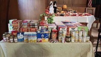 [CREDIT: Lincoln Smith/Member of Photographic Society of RI] Part of the food collected during the Lakewood Baptist Thanksgiving Food Drive.